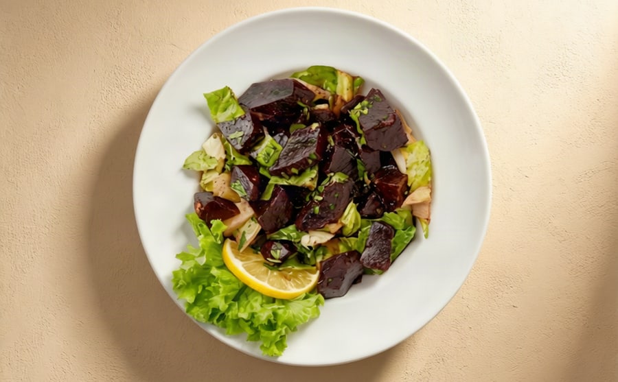 Beet salad at Derian, Yerevan — Beetroot and greens — earthy and sweet, deep red against everything else on the table, and lighter than it looks.