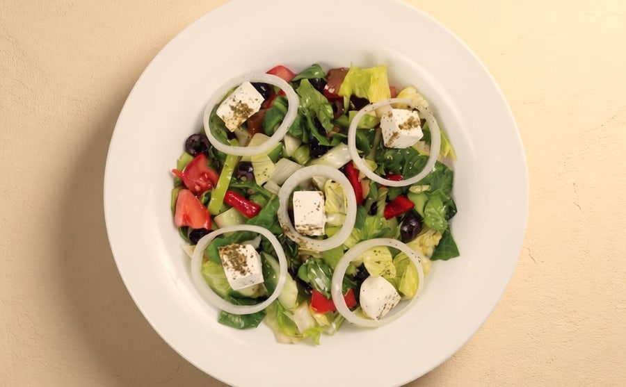 Greek salad at Derian, Yerevan — Tomato, cucumber and onion with olives and cheese — cold, salty and familiar, the salad everybody at the table will eat.