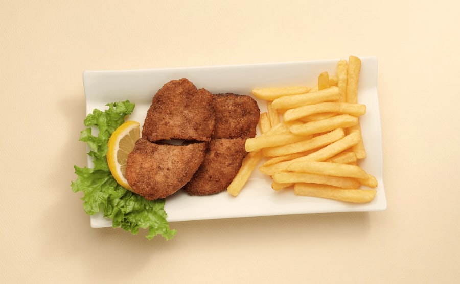 Habret samak at Derian, Yerevan — Spiced fish, fried until firm and served with lemon — light against the rest of the page, and better with a pickle.