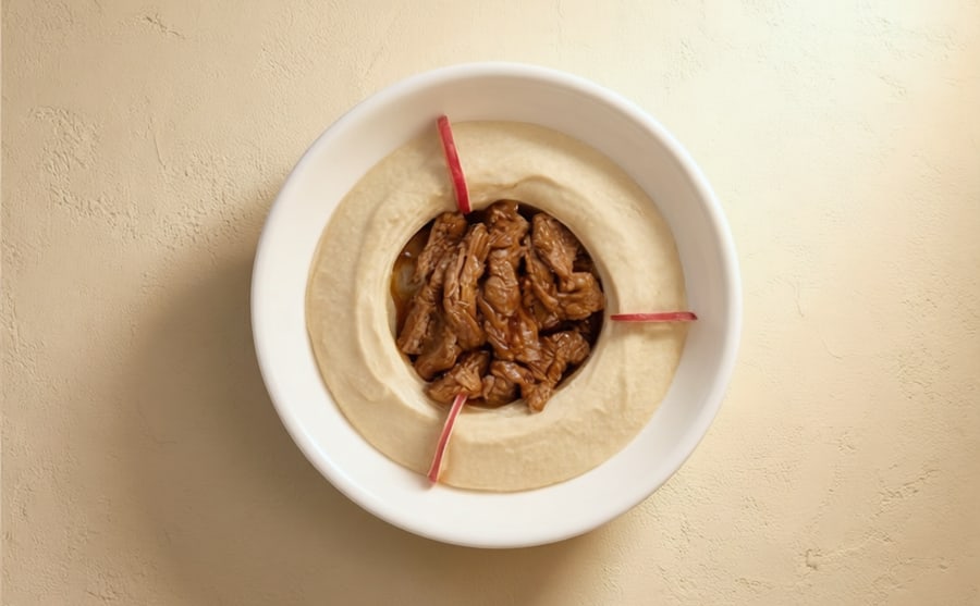 Hummus with tika at Derian, Yerevan — Chickpeas and tahini crowned with pieces of beef tika, still warm from the grill — hummus with the volume turned up.