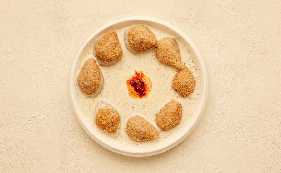Kufta with meat at Derian, Yerevan — Meat kufta simmered in tomato sauce — deeper and sweeter than the yogurt version, and a plate that asks for rice.