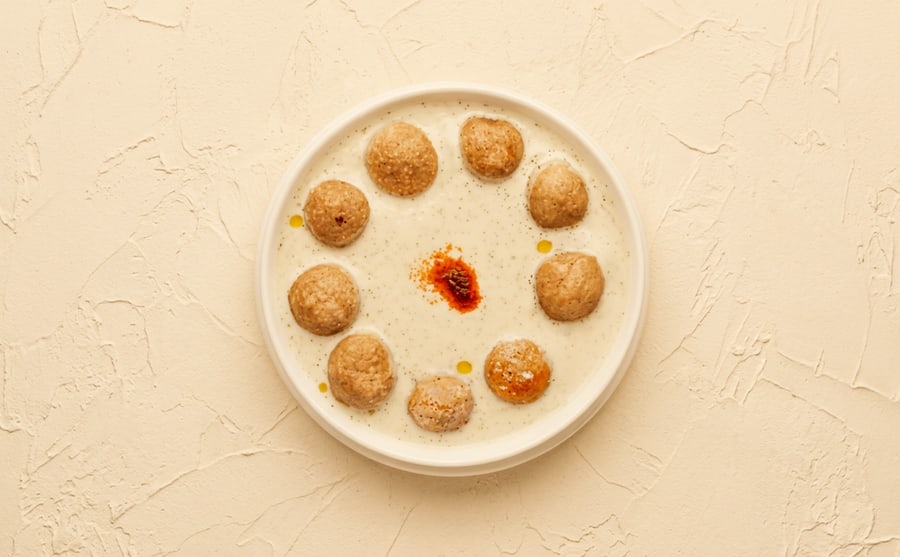Kufta with yogurt at Derian, Yerevan — Meat kufta under warm yogurt — soft, tangy and mild, one of the gentler plates and a good place to send a child.