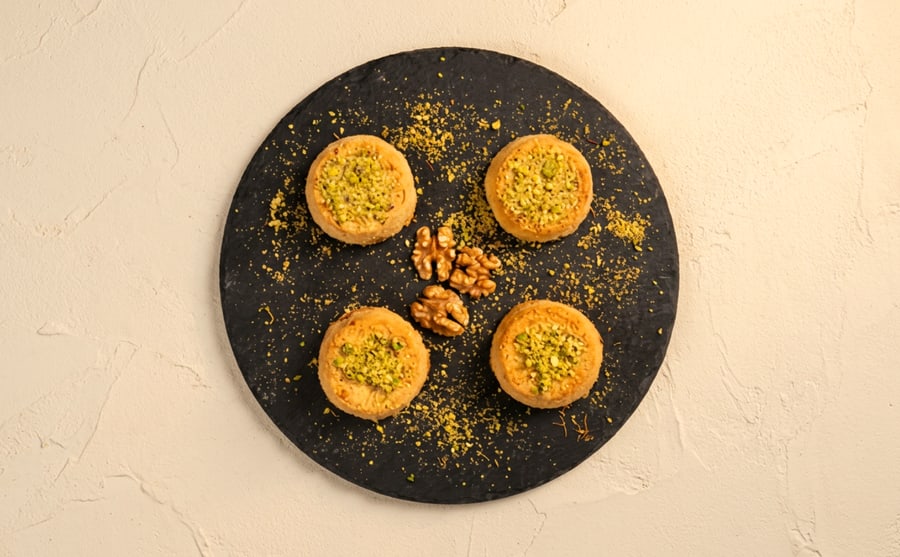 Kunafe with nuts at Derian, Yerevan — The same warm semolina pastry, this time packed with crushed nuts and steeped in syrup — sweeter, and less of a stretch.