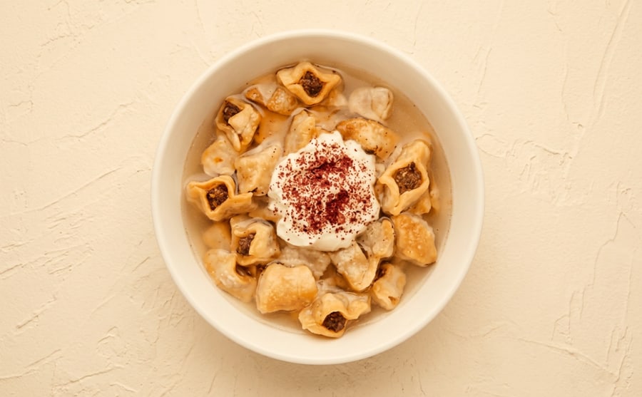 Mante at Derian, Yerevan — Tiny dumplings baked and served in broth, finished with garlic, sumac and yogurt — fiddly to make, quick to vanish.