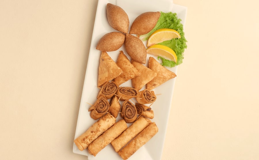 Mix fried at Derian, Yerevan — The full spread of fried pastries and kufta on one plate — the order that settles an argument about where to begin.