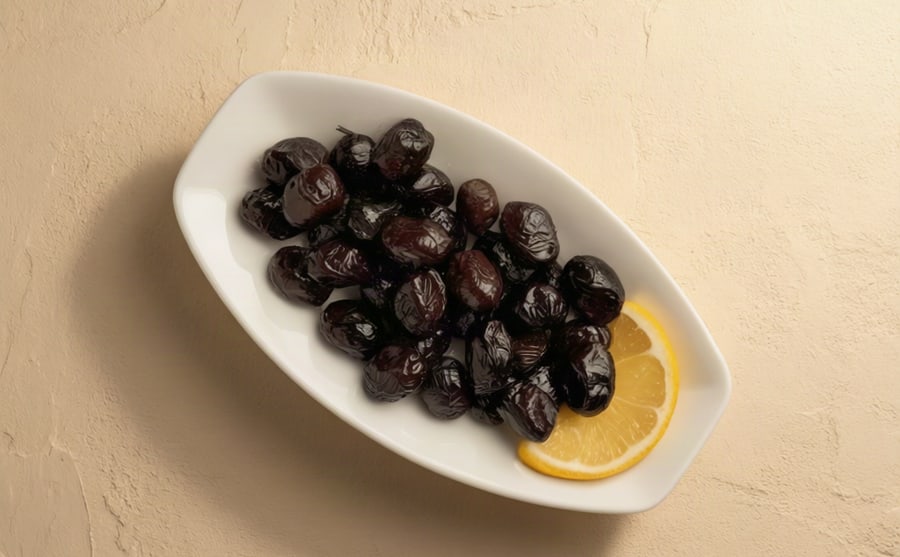 Olives at Derian, Yerevan — A bowl of mixed green and black olives — salty, firm and useful, and it stays on the table from first plate to last.