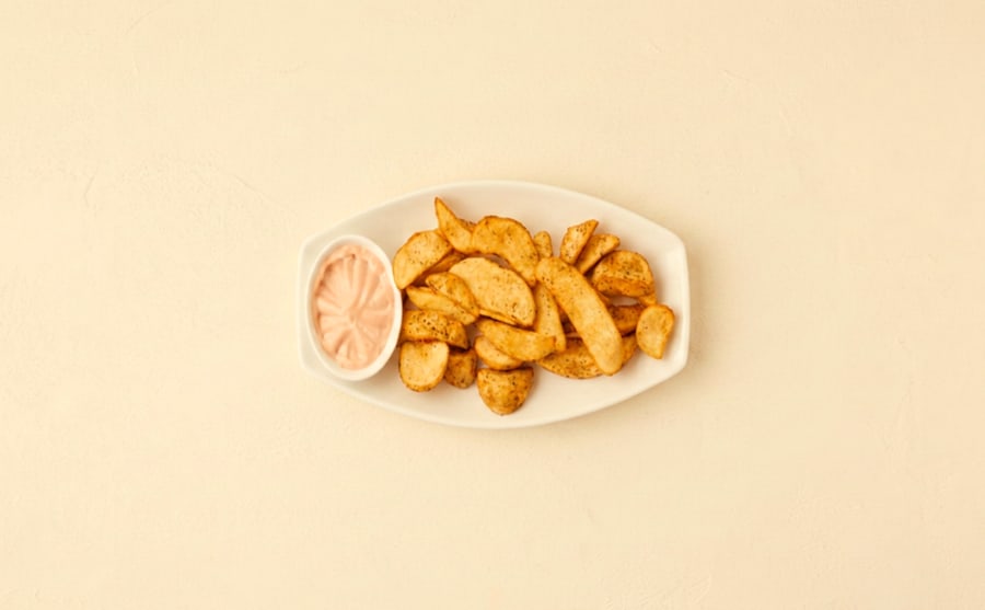 Wedges at Derian, Yerevan — Thick-cut potato wedges, fried soft inside — plainer than the spiced version, and better for dipping in garlic cream.