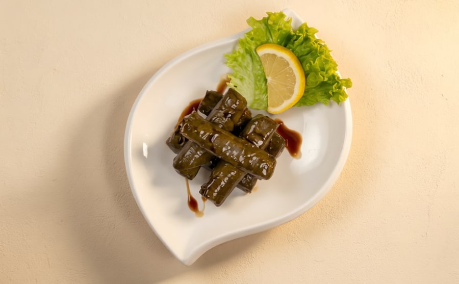 Yalanchi at Derian, Yerevan — Vine leaves stuffed with rice, onion and a touch of pomegranate molasses — soft, tangy, and made to be shared.